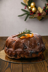 Panettone holiday cake on a wooden background
