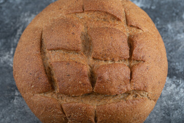 Delicious baked bread on a grey background