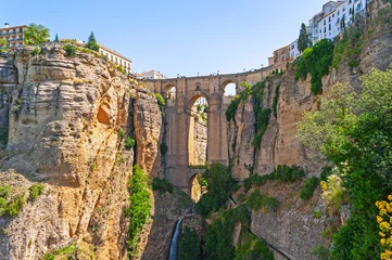 Fotobehang Ronda Puente Nuevo The Puente Nuevo – the New Bridge – is the most famous of the bridges in Ronda, Andalusia