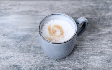 Coffee with milk. Wooden background. Close up. Copy space.