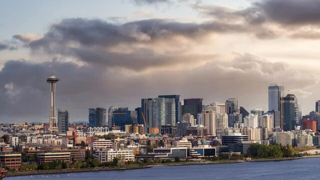 Cinemagraph Continuous Loop Animation. Downtown Seattle, Washington, United States of America. Aerial Panoramic View of the Modern City on the Pacific Ocean Coast. Dramatic Sunset Sky Art Render.