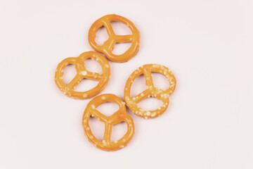 Four salty crackers in the center of a white background