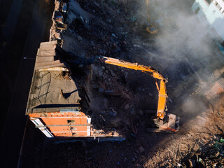 Aerial view of demolition site. Process of demolition of old industrial building