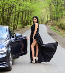 Fototapeta na wymiar Car and wanderlust girl travel on foot. Transport. Sensual girl travel along road. Road trip. Adventure and discovery. Traveling and wanderlust. Travel is to discover. Fashion model with sensual look