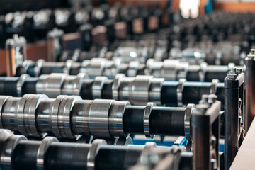 Obraz premium equipment and modern production line of rolling metal roofing profile sheets