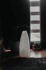 Corner of the bedroom against the background of the window