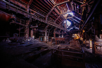 Old rusty abandoned metallurgical plant. Ruined blast furnace