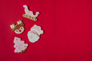 Flat lay composition with tasty homemade Christmas cookies on red background