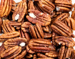Peeled pecans in bulk, soft brown and golden or coppery