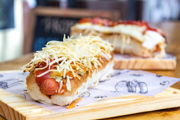 Two venezuelan hot dogs with cheese