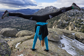 young blonde girl enjoying in the mountains