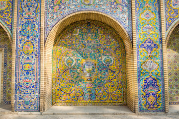 Vintage colorful mosaic ceramic tile wall of the royal Golestan Palace in Tehran, Iran, which is a...