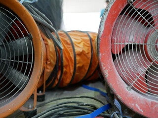 closeup of exhaust fan or portable ventilation fan at construction site.