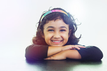 Smiling Portrait of Little Girl Wearing a Colorful Headband, Isolated, White