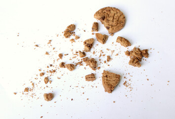 Chocolate chip cookies with crumbs isolated on white background