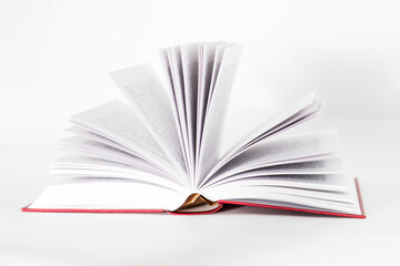 Isolated opened book with red cover