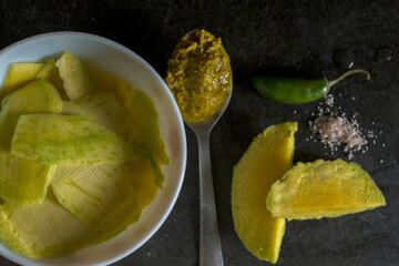 Very tasty and healthy raw mango pickle with mustard sauce and green chilly and rock salt.