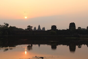 Fototapeta na wymiar Cambodia. Angkor Wat temple. Sunrise. The Hindu temple was built at the beginning of the 12th century, during the reign of Suryavarman II. Siem Reap city. Siem Reap province.