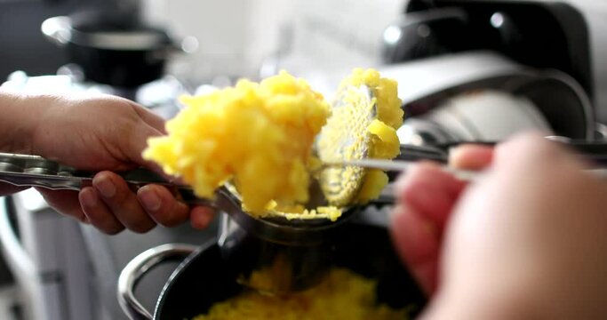 Close-up hands preparing mandioc food pressing ingredient