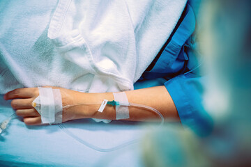 Medical Care, Close up image of IV drip in patient's hand in hospital.