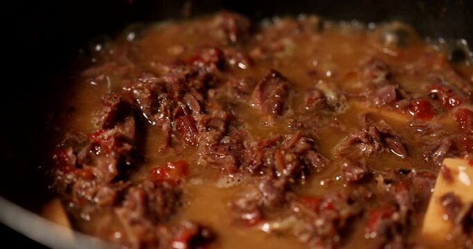 Cooking osso buco meet inside pan. braised veal food close-up