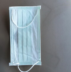 A mask that is placed upside down for a clear view of the harness section. Wearing a mask and washing your hands with gel is essential during the COVID-19 epidemic.
