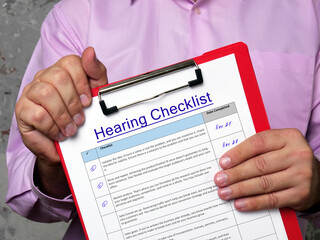 Business concept about Hearing Checklist with phrase on the piece of paper.