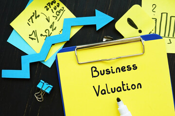 Financial concept meaning Business Valuation with sign on the sheet.