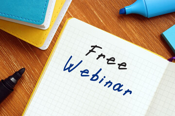 Free Webinar sign on the piece of paper.