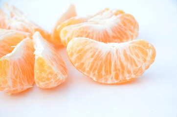 the ripe yellow peels orange isolated on white background.