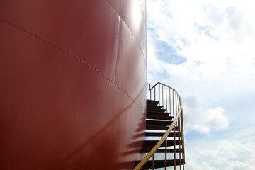 Big oil tank and stairs in the side