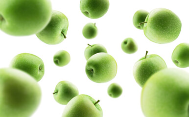 Green apples levitate on a white background