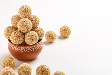 Indian sweet for traditional festival makar sankranti :Rajgira laddu made from Amaranth seed in Bowl on white background