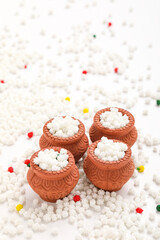 Indian festival makar sankranti concept : Tilgul in small bowl. Tilgul is a colourful sesame candy coated with sesame seeds; in Maharashtra people exchange tilgul on Sankranti