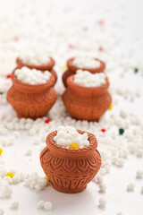 Indian festival makar sankranti concept : Tilgul in small bowl. Tilgul is a colourful sesame candy coated with sesame seeds; in Maharashtra people exchange tilgul on Sankranti