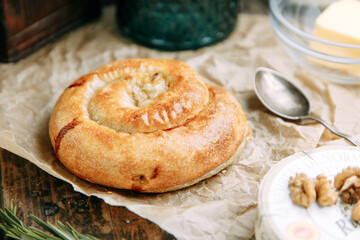 Traditional Moldovan and Romanian cake in the shape of a snail. Swirling round pie close-up.