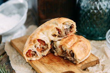 Traditional Moldovan and Romanian cake in the shape of a snail. Swirling round pie close - up in the cut.
