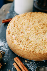 Sour cream cake close-up. Sweet dessert with cream on the table.