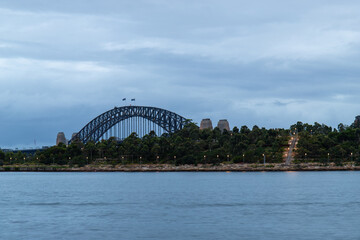 Naklejka premium Sydney Harbour Bridge with cloudy sky.
