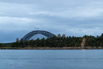 Sydney Harbour Bridge with cloudy sky.