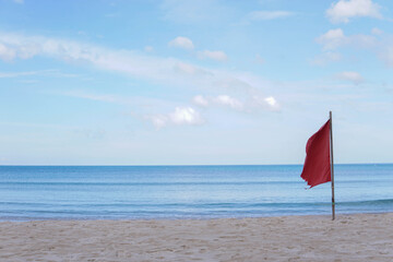 Red flags indicate dangerous areas for swimming in the sea.