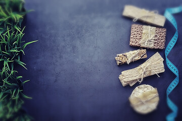 Tilt shift effect.Concept of losing weight and a healthy lifestyle. Bread roll with vegetables and herbs on table.Proper nutrition.Dry bread rolls diet.