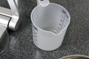 Measuring Cup on Granite Surface