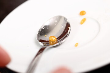 Drop of caramelized sugar on spoon