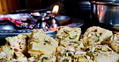 Indian Diwali Sweet Food Kalakand Also Know as Halwa or Mawa Kalakand is a Creamy Delicacy Made From Paneer or Cottage Cheese, The Dish Originated in Alwar, Rajasthan. Isolated on White Background
