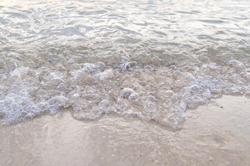 Blank fine sand and white wave, nature background.