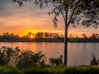 Fototapeta na wymiar Beautiful Riverside Sunset with Reflections