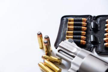 .44 magnum revolver gun with bullet on white background