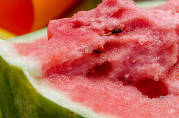 Ripe, juicy, red, sweet, watermelon pulp close-up. Macro. A piece of red berry, pulp texture.