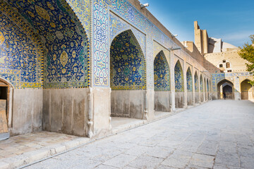 Arches of Historic buildings with persian blue tiles on the wall of Shah Mosque, situated on the south side of Naqsh-e Jahan Square  , an important historical site.